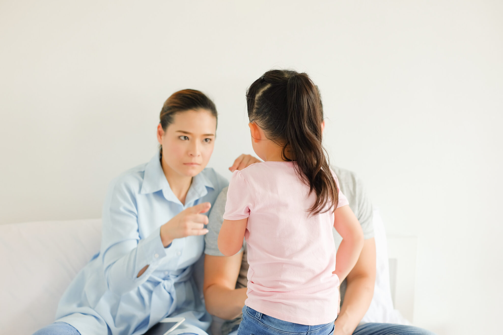 Parent speaking with a child during a serious family discussion | Hemmat Law Group