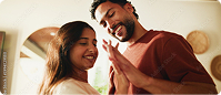 Smiling couple sharing a warm moment together indoors | Hemmat Law Group